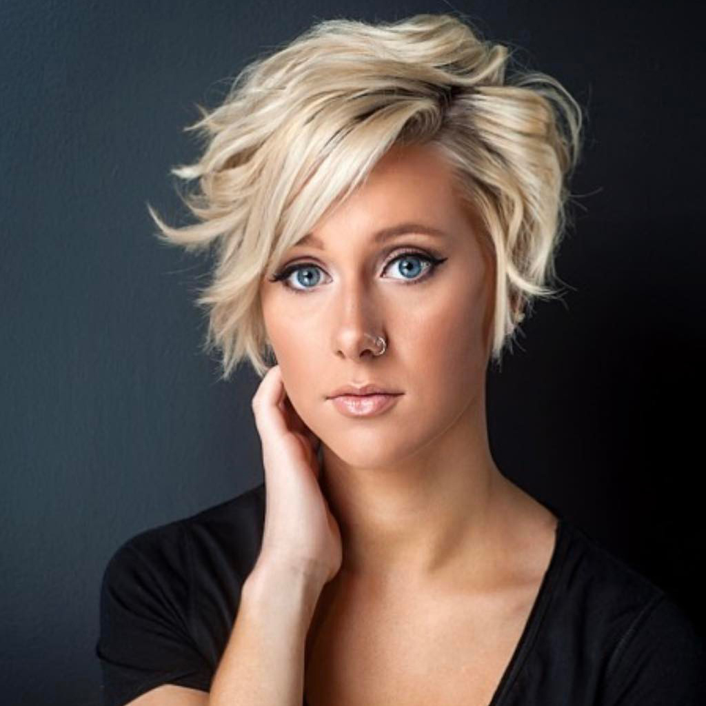Sleek and chic blonde pixie cut hairstyle on a woman.