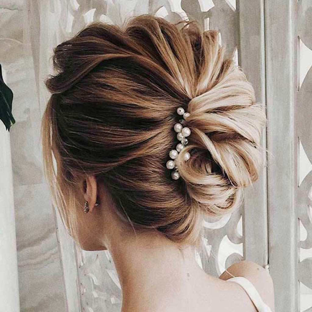  A polished and sophisticated woman with an elegant chignon for formal events.