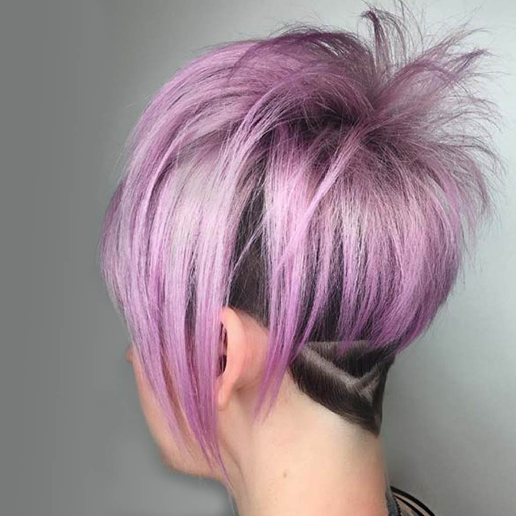 Woman with a pixie cut featuring geometric patterns.