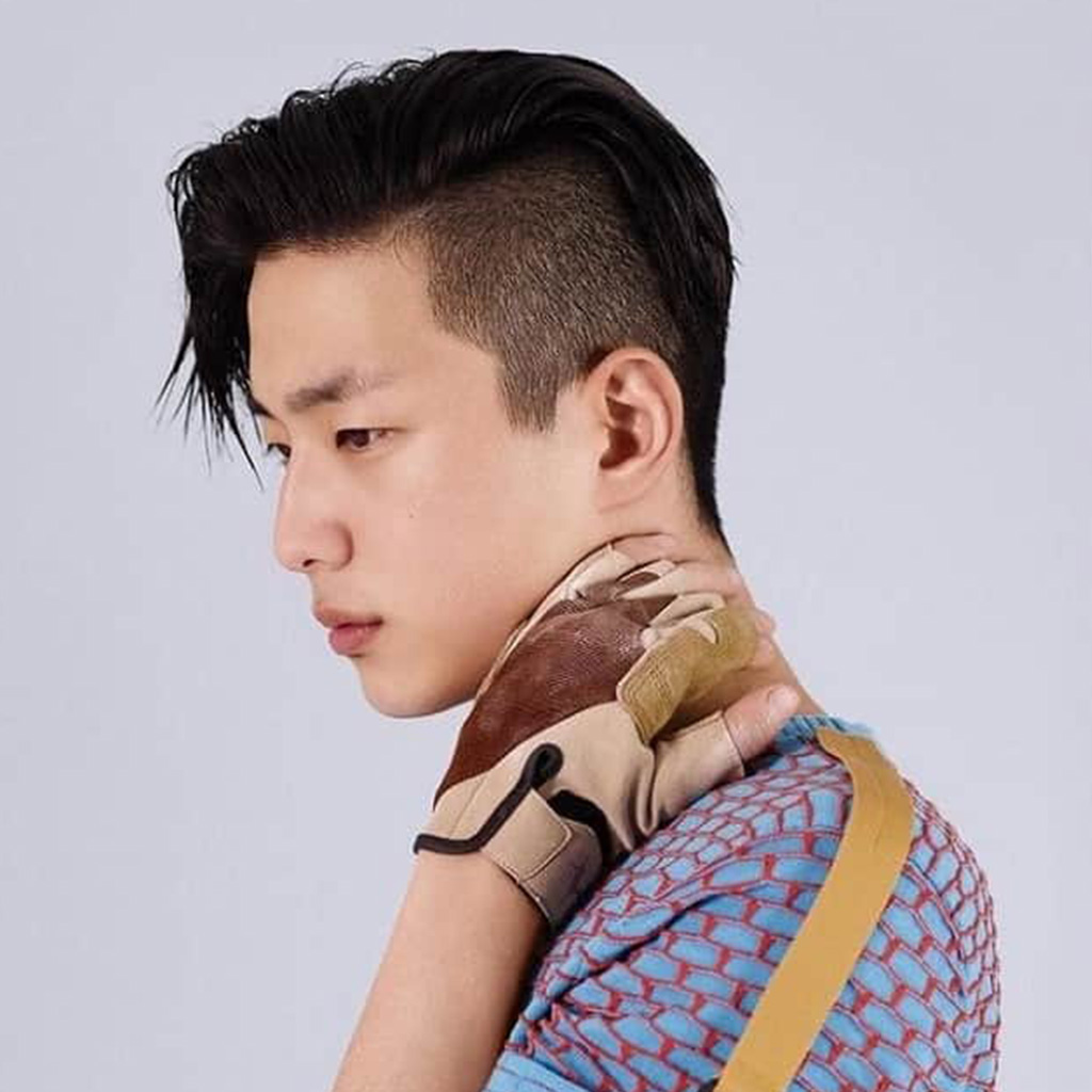Korean man with a side swept undercut hairstyle