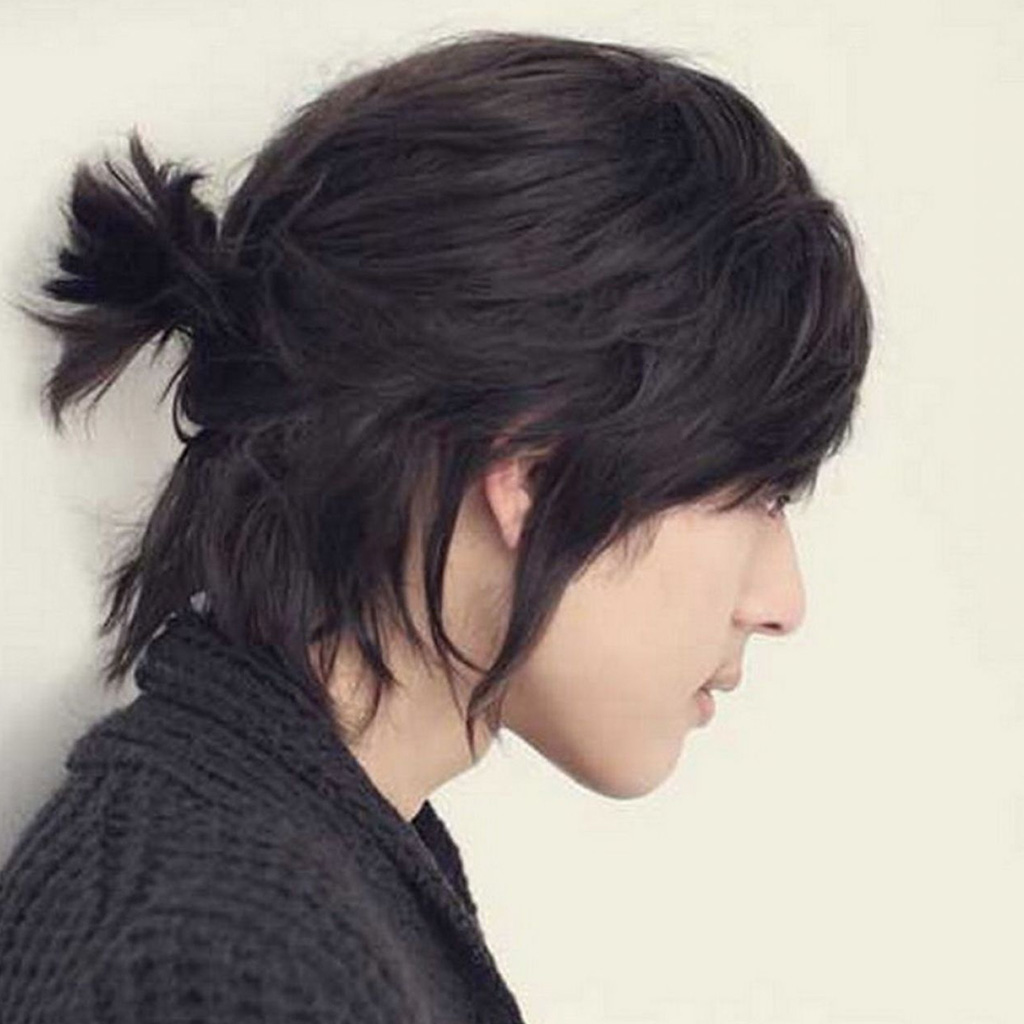 Korean man with a sleek low ponytail hairstyle