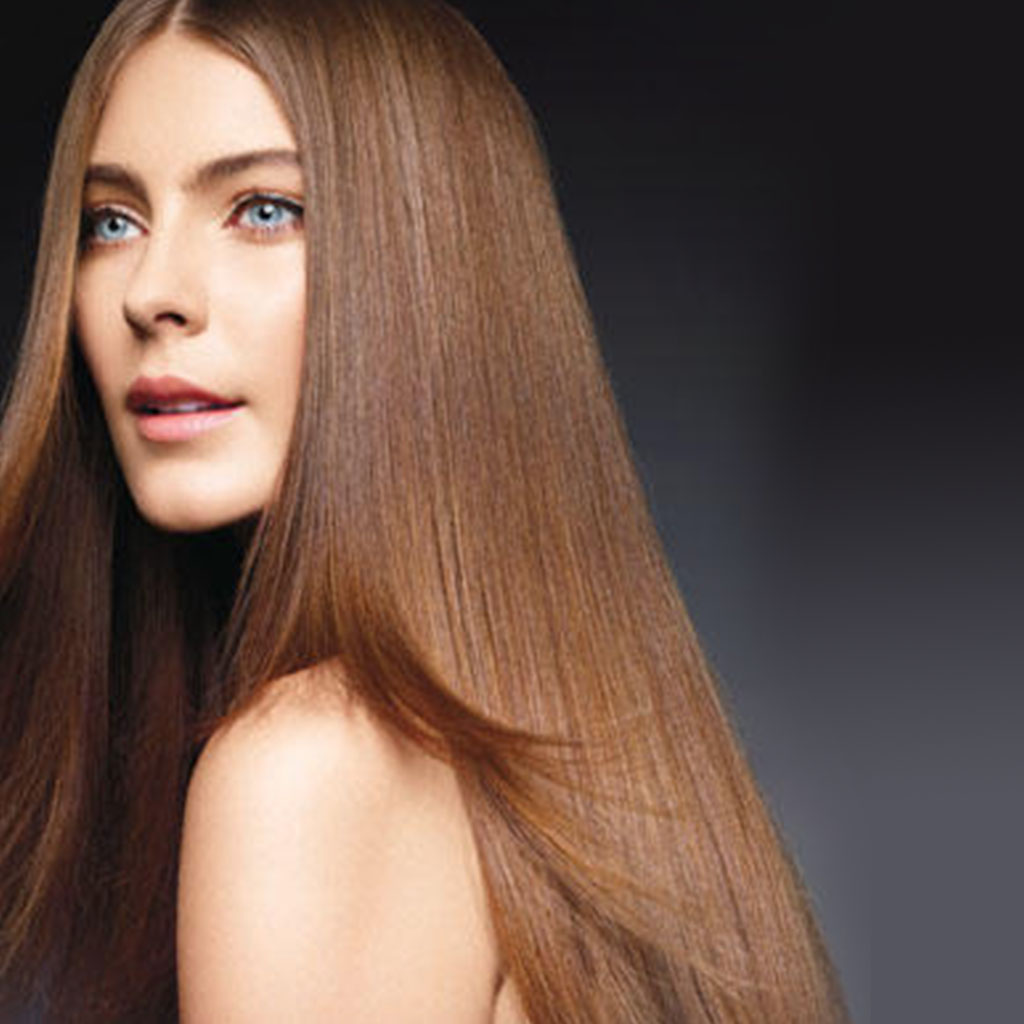 A woman with sleek straight hair representing a classic and sophisticated style.