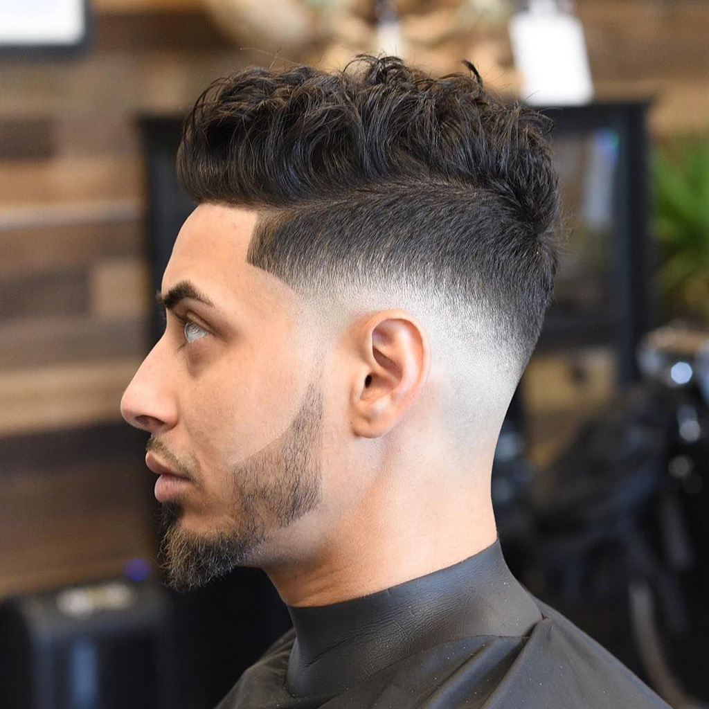 The Mid Fade Mohawk - A trendy Mohawk style with a mid-level fade.