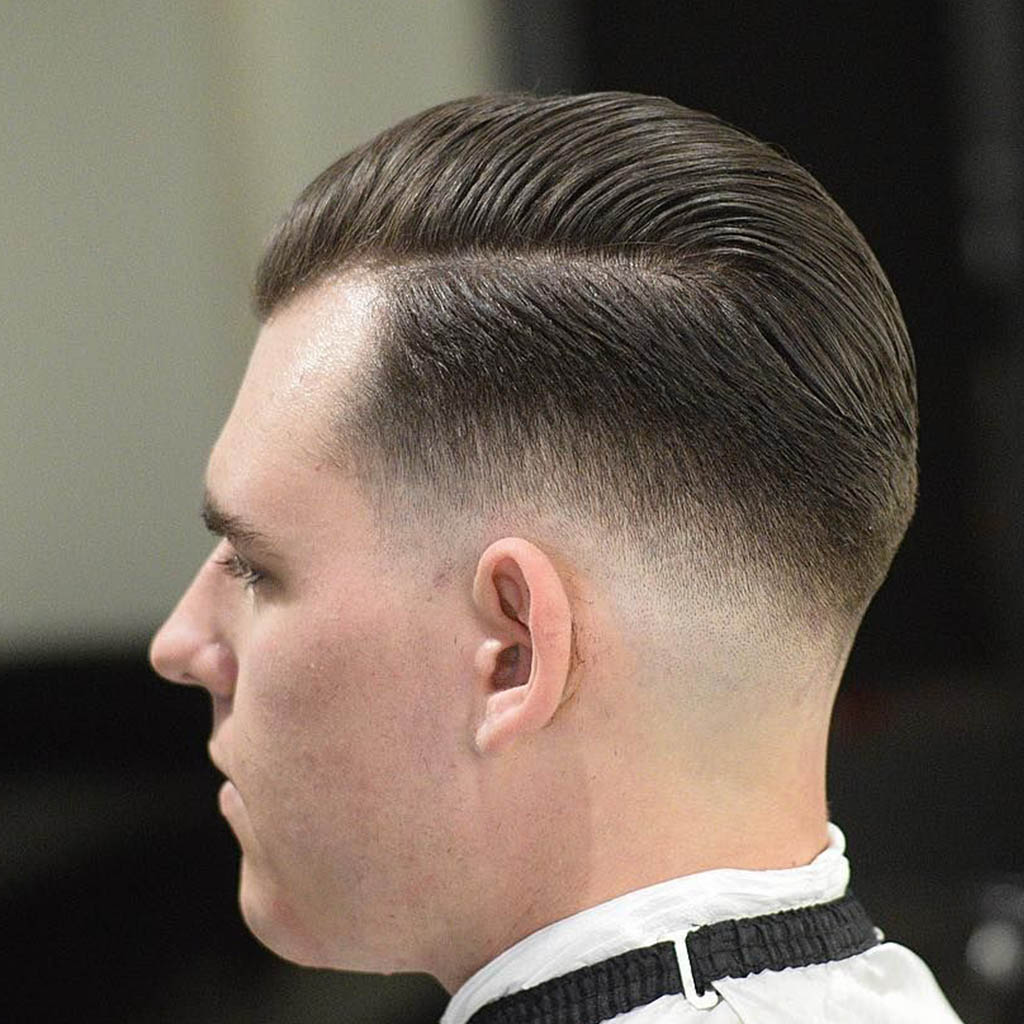 A man with a retro-inspired Wolf Cut for men, reminiscent of classic Hollywood icons