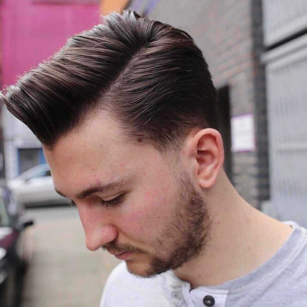 The Taper Fade Comb Over Haircut For Men - A refined and stylish comb-over with a taper fade.