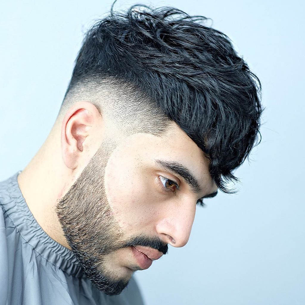 A man with a hair Cut styled into a textured crop, featuring a trendy and low-maintenance look