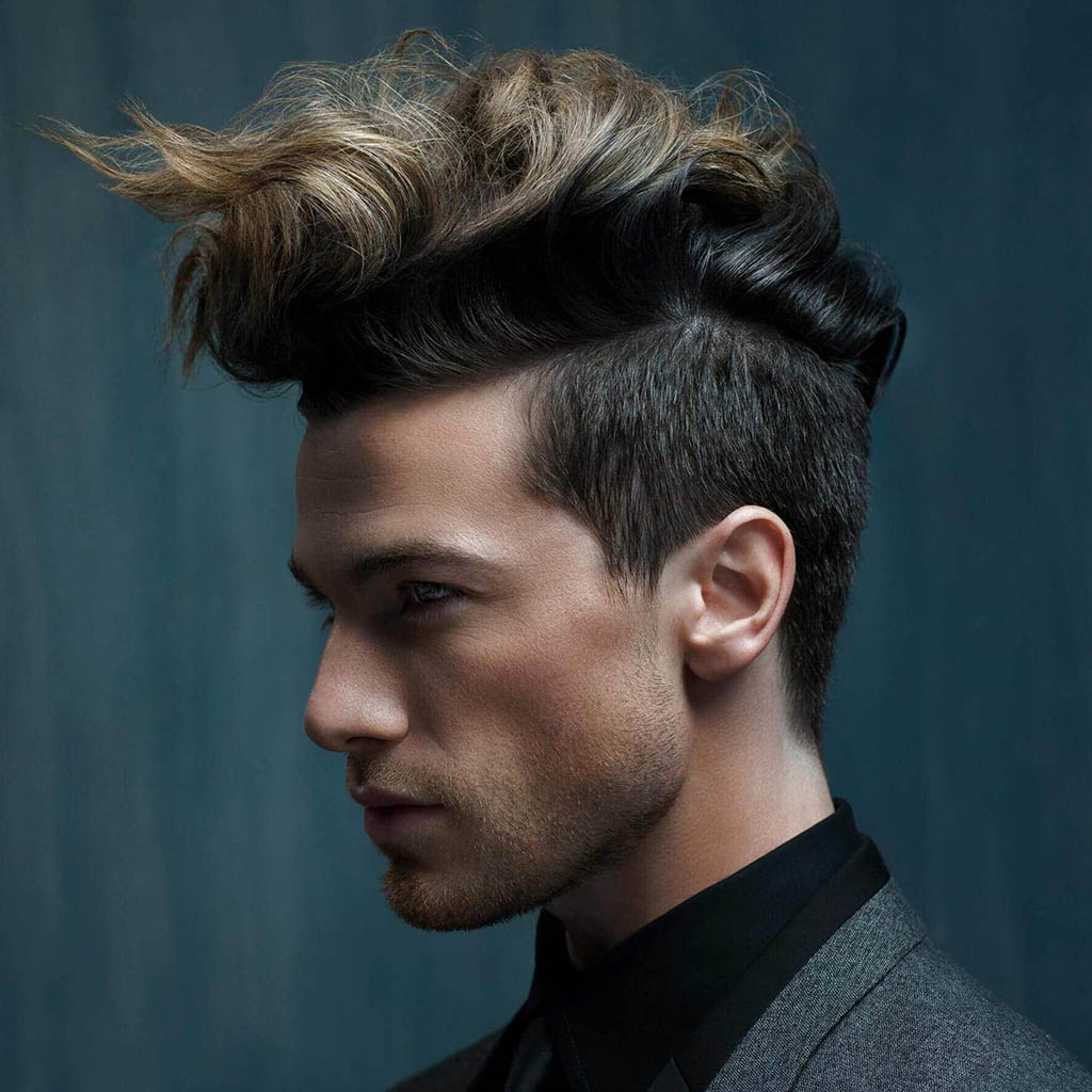 A man with a voluminous Wolf Cut hairstyle for men, showcasing fullness and texture