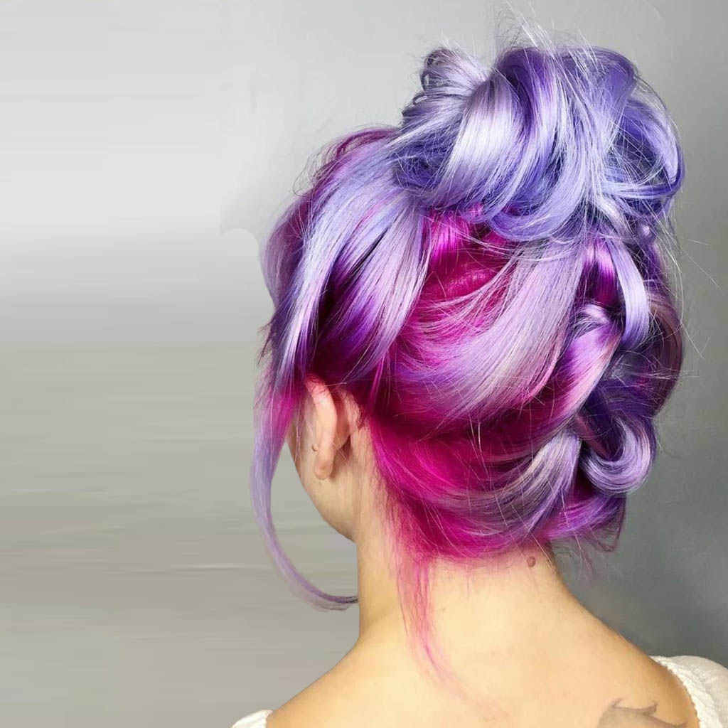 Woman with colorful streaks, adding a fun and vibrant touch to her hair.