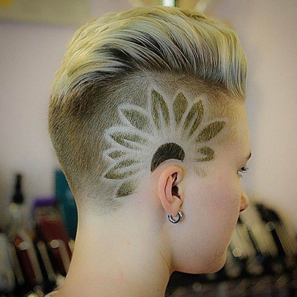 A feminine undercut adorned with delicate floral patterns.