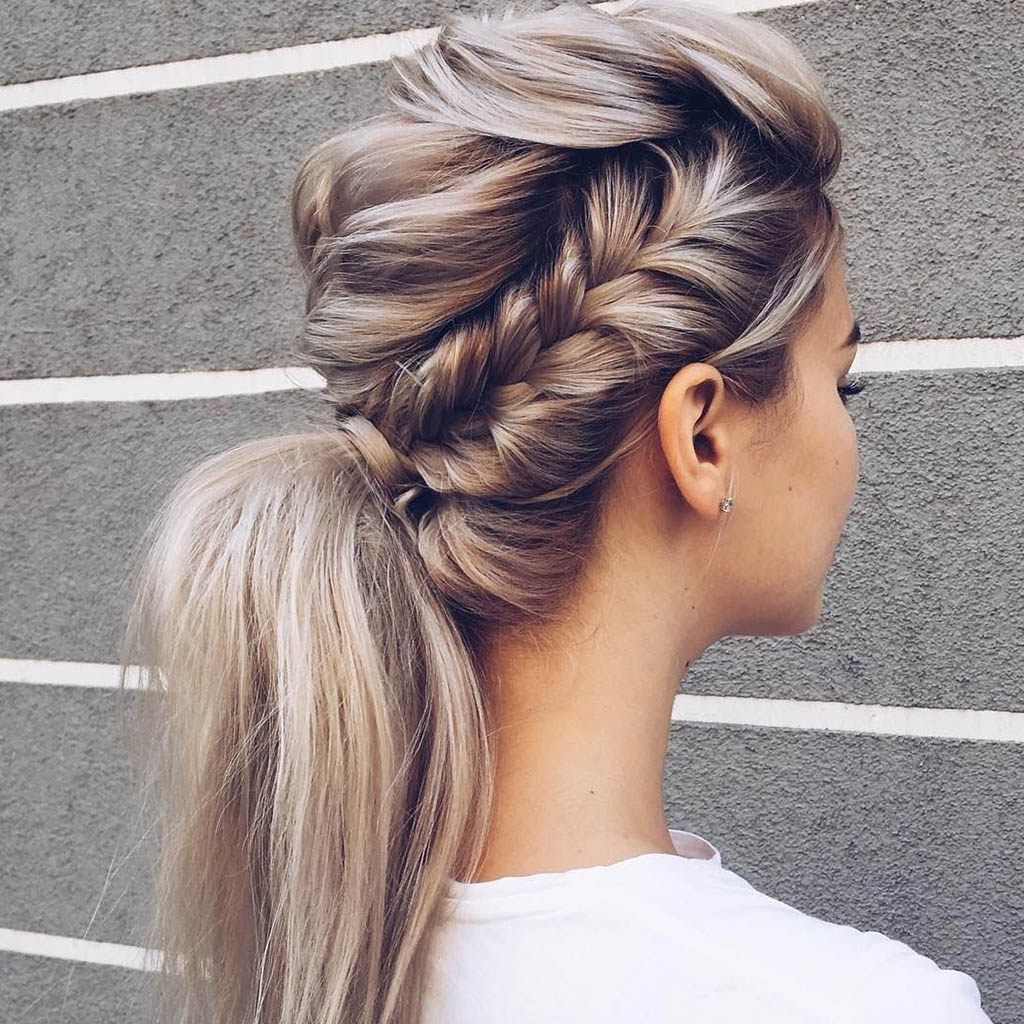 A chic fishtail braid hair cut for women, radiating an effortlessly elegant and modern vibe.