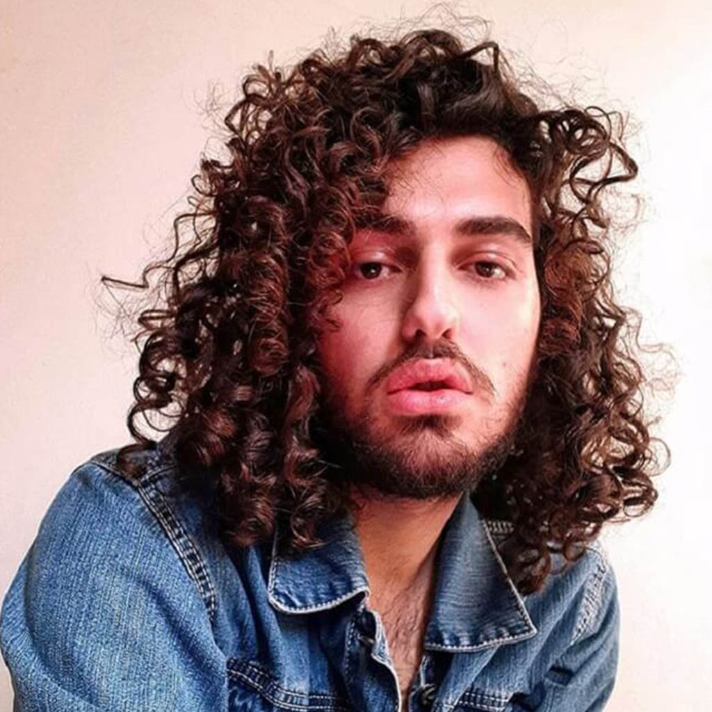 Man with long curly hair