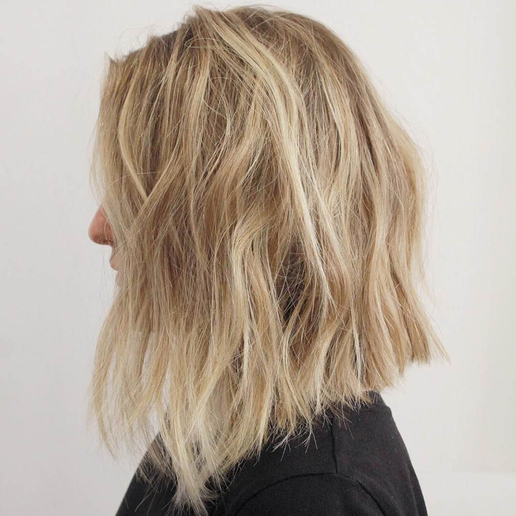 A textured lob hair cut for women, showcasing effortless and laid-back charm.
