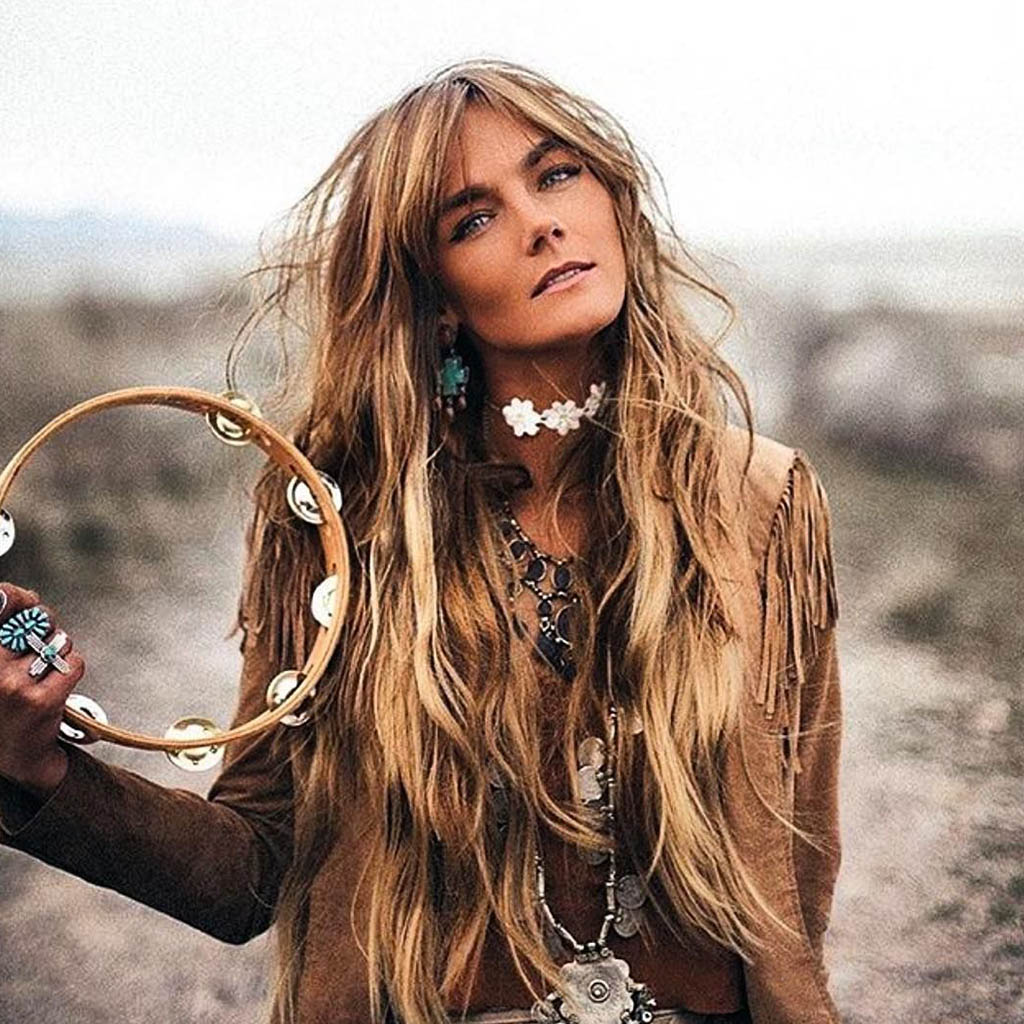 A woman with a bohemian-inspired Wolf Cut hair style