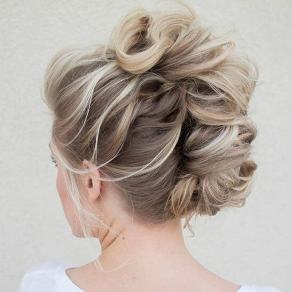 A woman with a timeless French twist hairstyle, exuding sophistication.